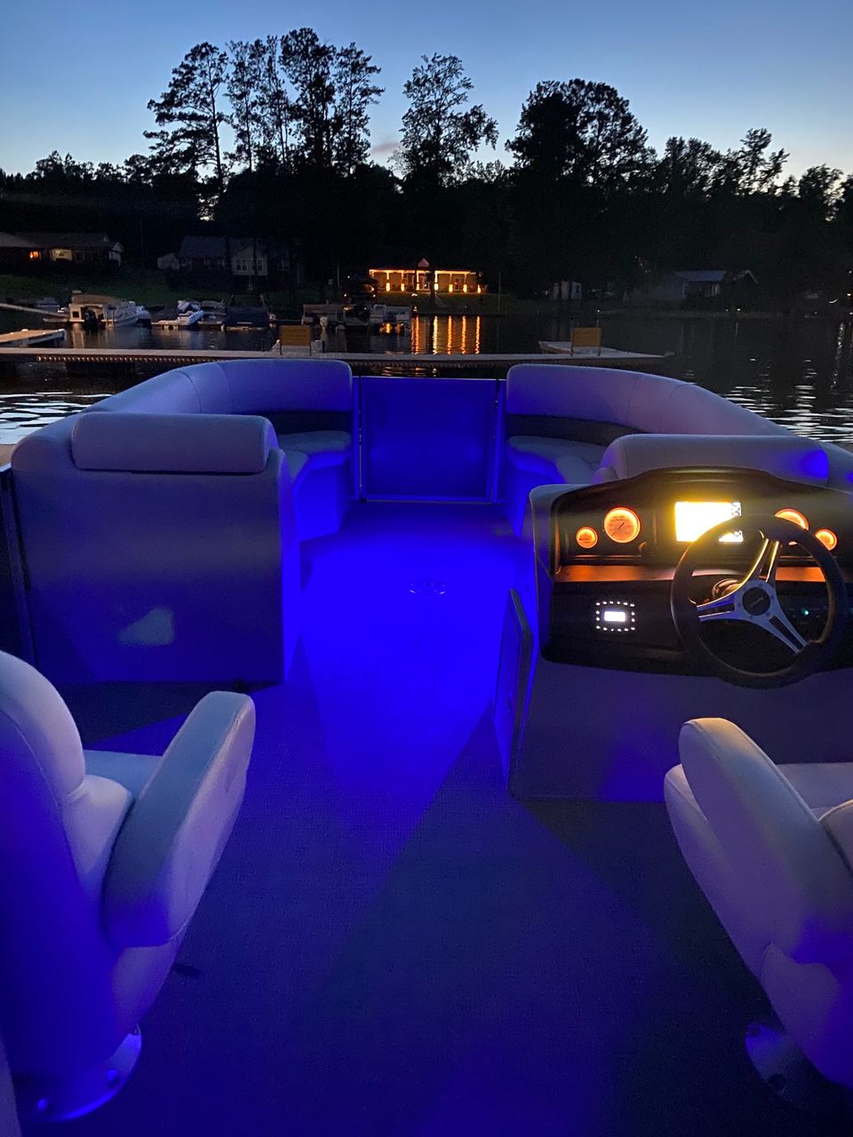 Deck of the Bentley Navigator 243 lit with blue lights at dusk